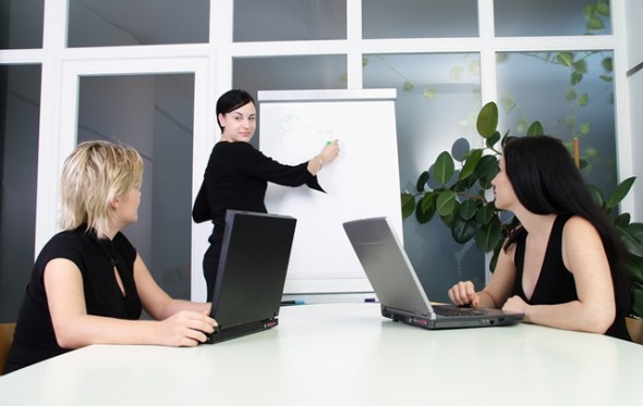 3 Women in a meeting strategizing