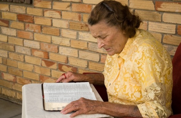 Elderly woman reading the Bible