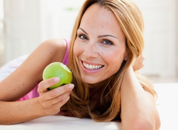 Woman eating healthy fruit