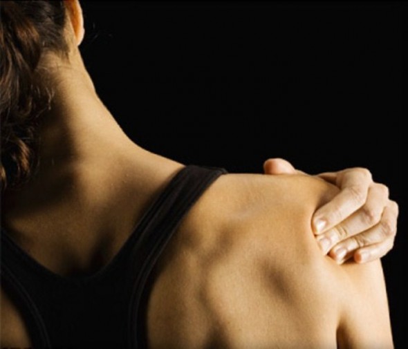 woman with sore muscles and pain