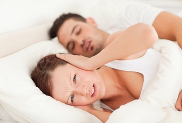 Man snoring & disturbing wife